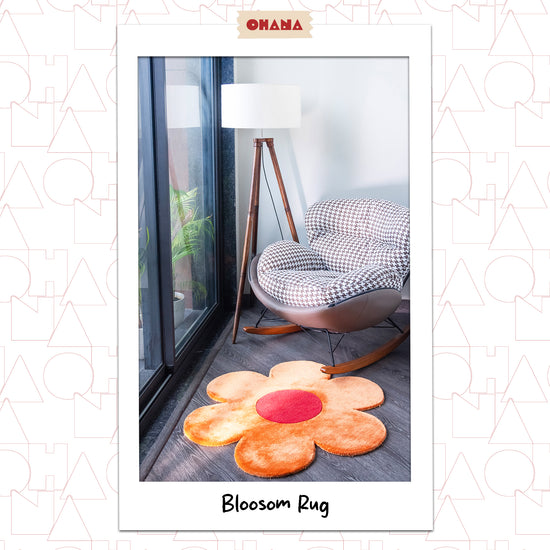 Orange Blossom Rug – hand-tufted orange flower-shaped rug by Ohana