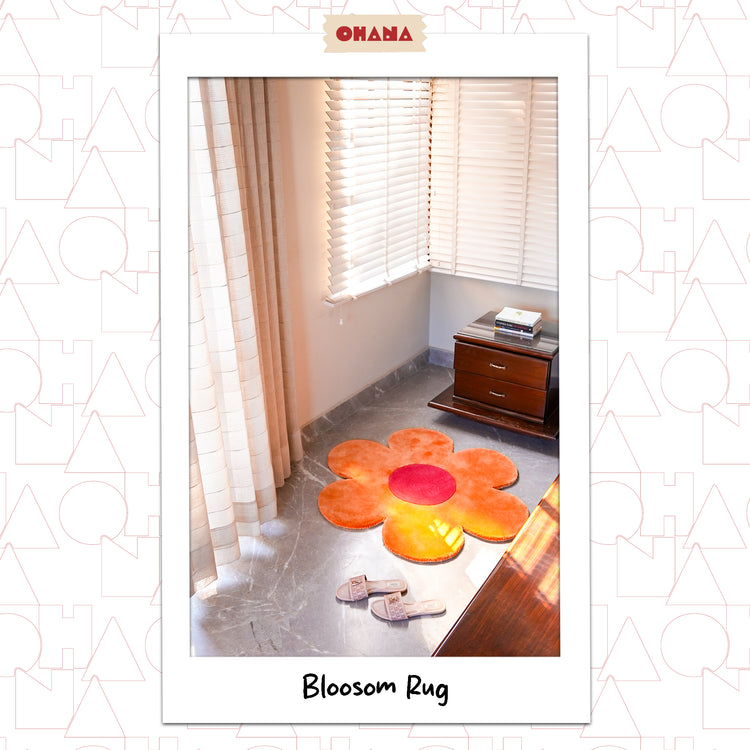 Orange Blossom Rug – hand-tufted orange flower-shaped rug by Ohana