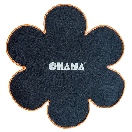 Orange Blossom Rug – hand-tufted orange flower-shaped rug by Ohana