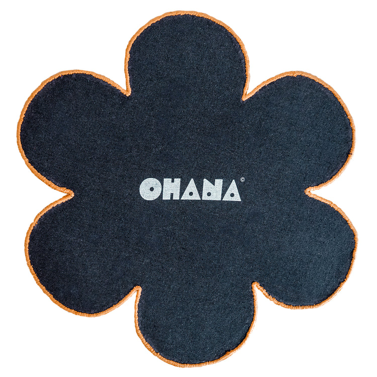Orange Blossom Rug – hand-tufted orange flower-shaped rug by Ohana