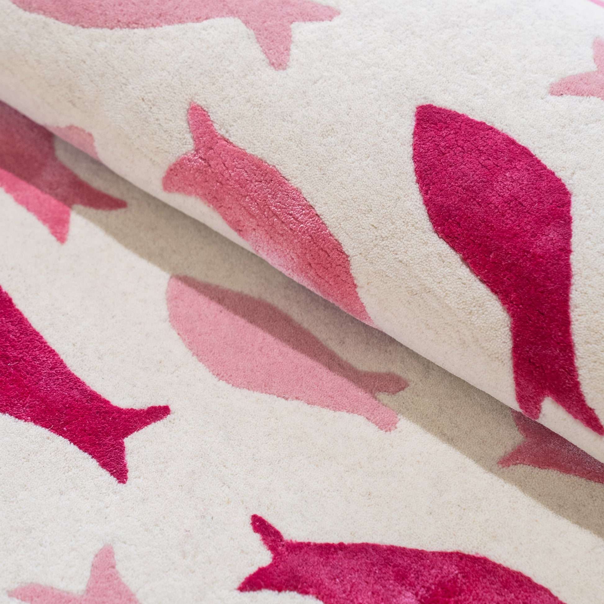 Fish Swirl Pink Rug – hand-tufted pink shaped rug by Ohana