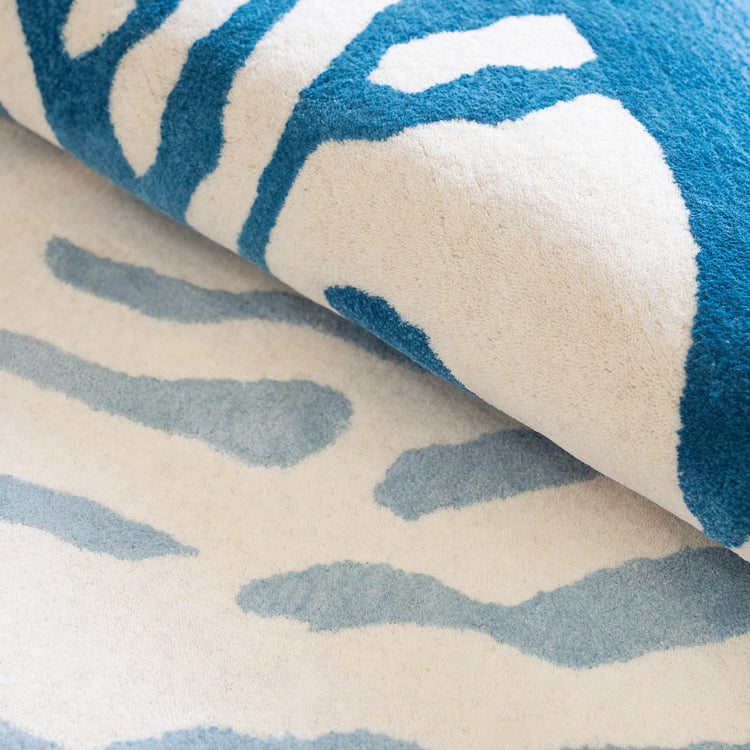 Nautilus Teal Rug – hand-tufted teal shaped rug by Ohana