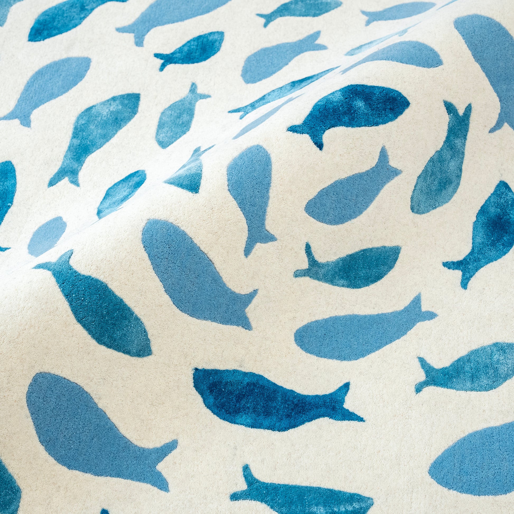 Fish Swirl Blue Rug – hand-tufted blue shaped rug by Ohana