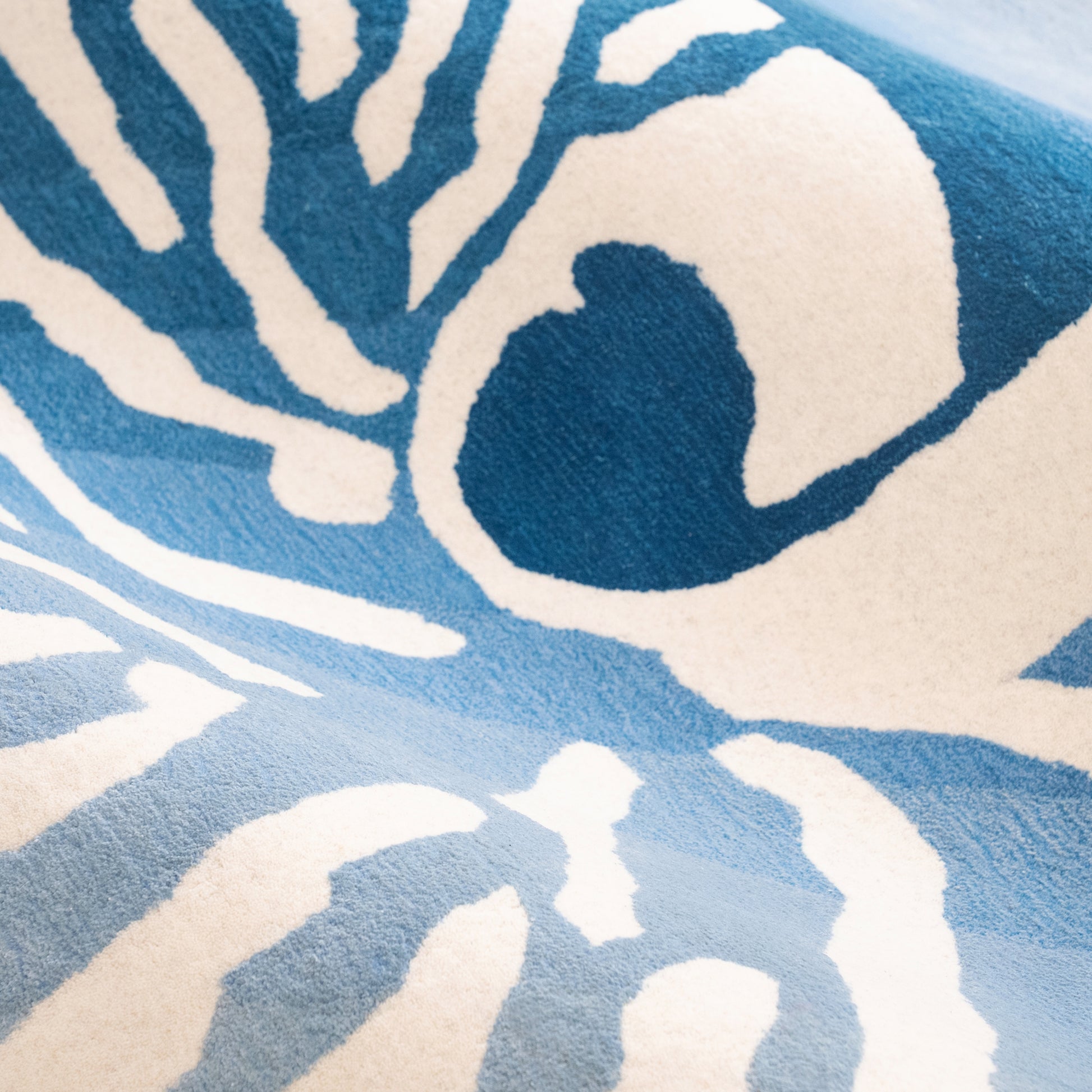 Nautilus Teal Rug – hand-tufted teal shaped rug by Ohana