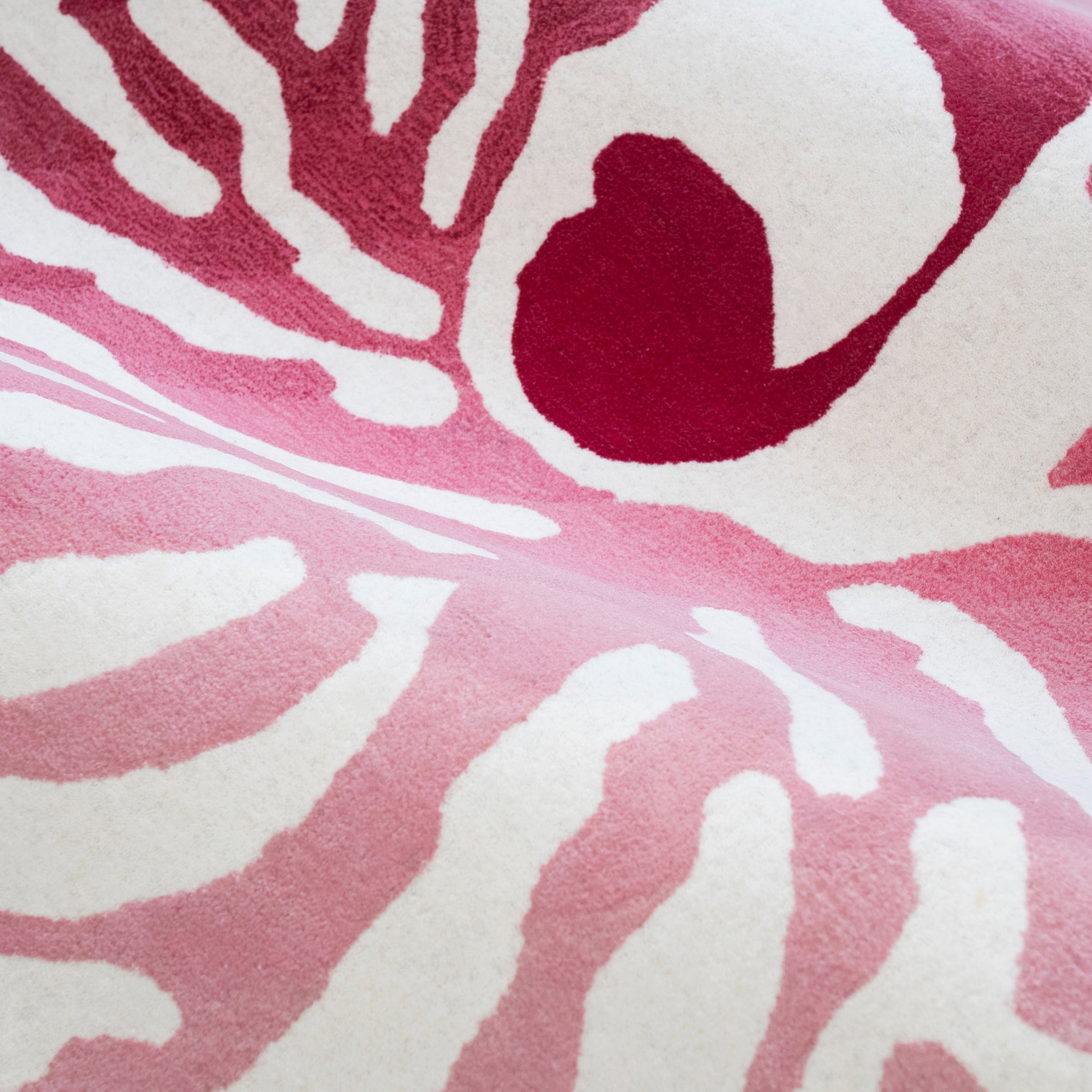Nautilus Pink Rug – hand-tufted pink shaped rug by Ohana